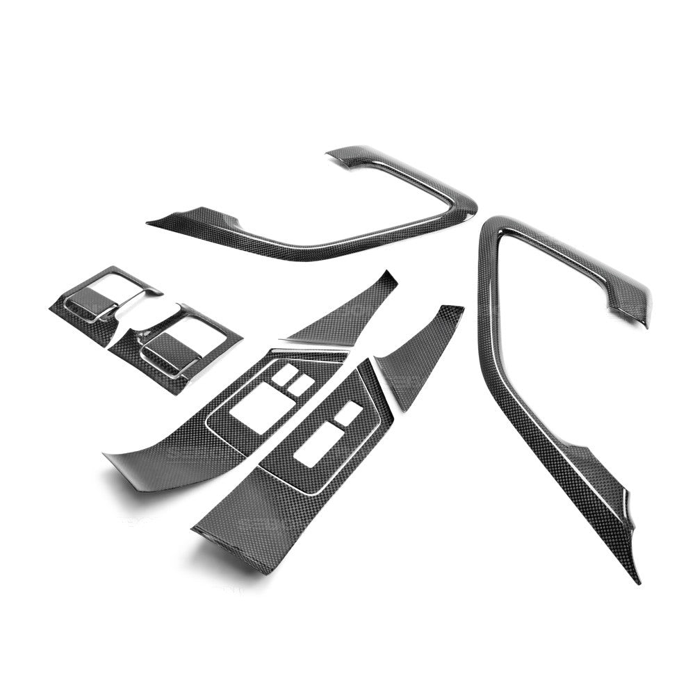 Seibon CFI0910NSGTR-C Carbon fiber interior door trim set (12 pcs) for 2009-2016 Nissan GTR. Pieces include: Door handle cover (2), window switch panel cover (6), door lever surround (4)